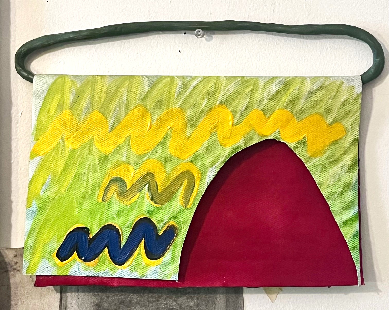 Flapped abstract landscape with a gateway to the blood garden (field of red) hanging on an olive green molded clay hinge/hanger