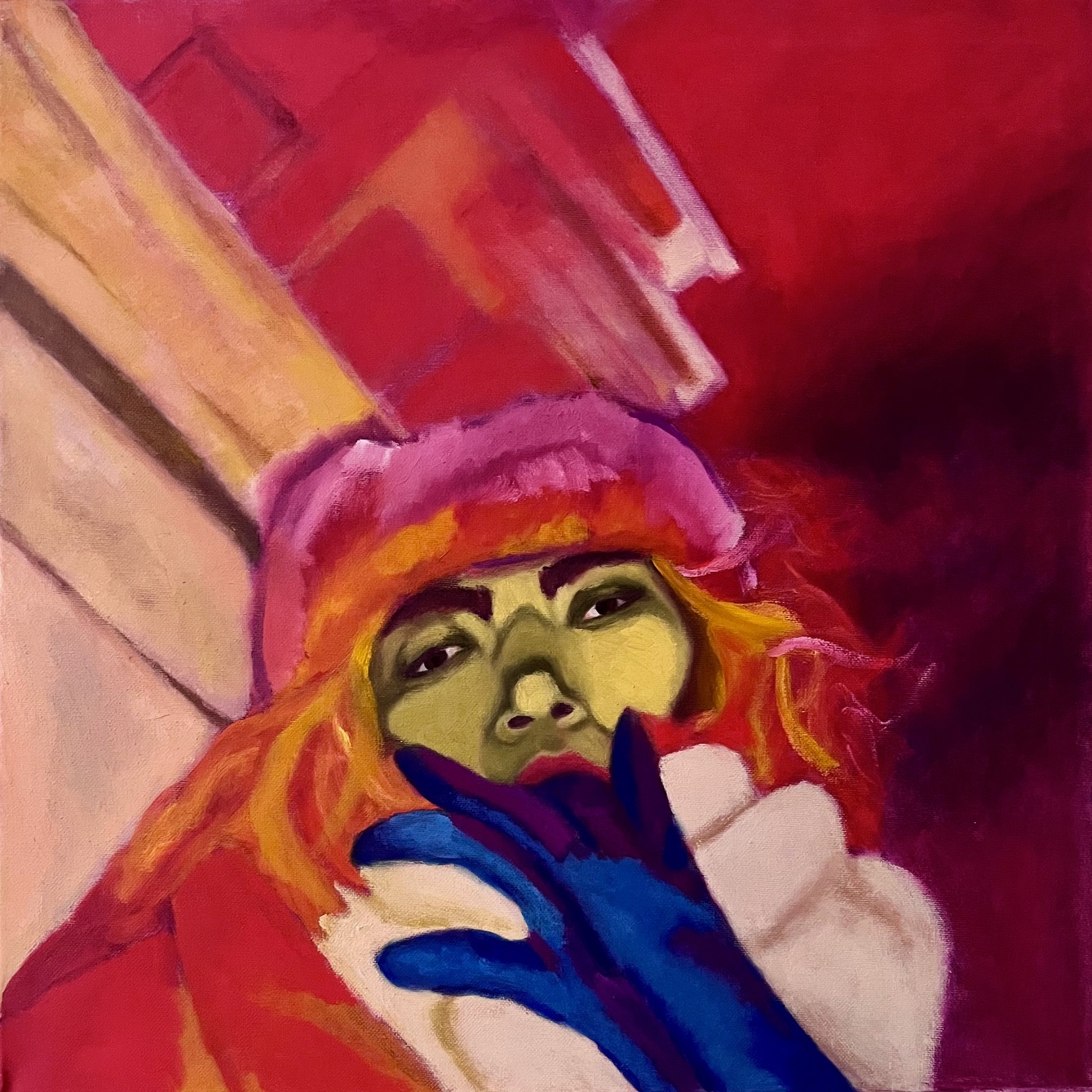 Portrait of the artist with a green face pulling off a blue glove